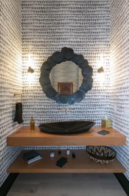 Luxury master bathroom walk-in shower featuring floor-to-ceiling marble tile, a frameless glass enclosure, and a built-in stone bench.