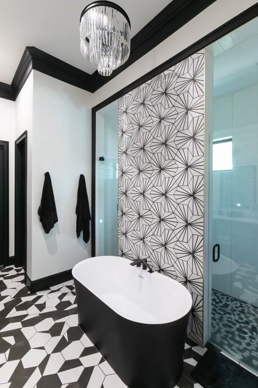 High-end bathroom vanity with dual sinks, white shaker-style cabinetry, and a thick marble countertop featuring grey veining.