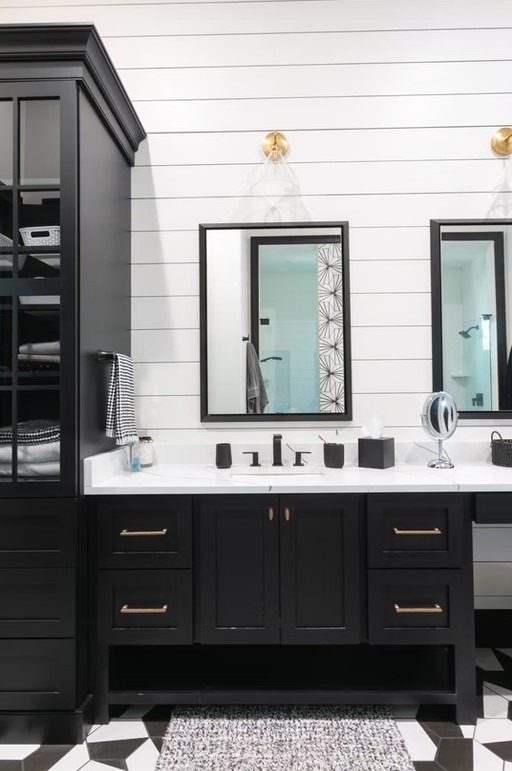 Luxury master bathroom walk-in shower with floor-to-ceiling marble tile, a frameless glass enclosure, and polished chrome hardware.