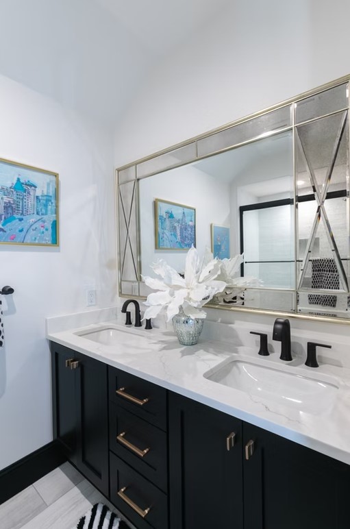 Luxury master bathroom featuring a freestanding white soaking tub, marble-tiled walls, and a large walk-in glass shower.