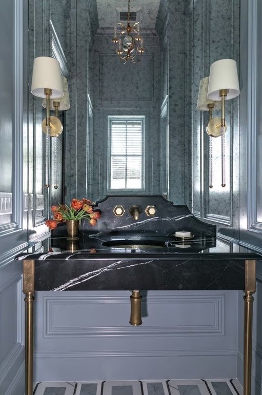 Luxury master bathroom featuring a freestanding white soaking tub, marble-tiled walls, and a large walk-in glass shower.