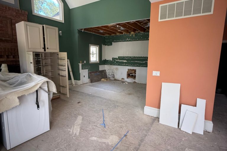An architectural or financial-themed image illustrating the major expenses in a home renovation, such as structural work, kitchen remodeling, and premium materials.
