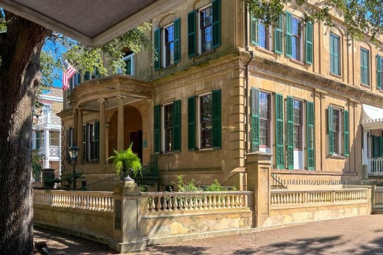 Historic home interior featuring original architectural details, ornate crown molding, and modern restoration elements.